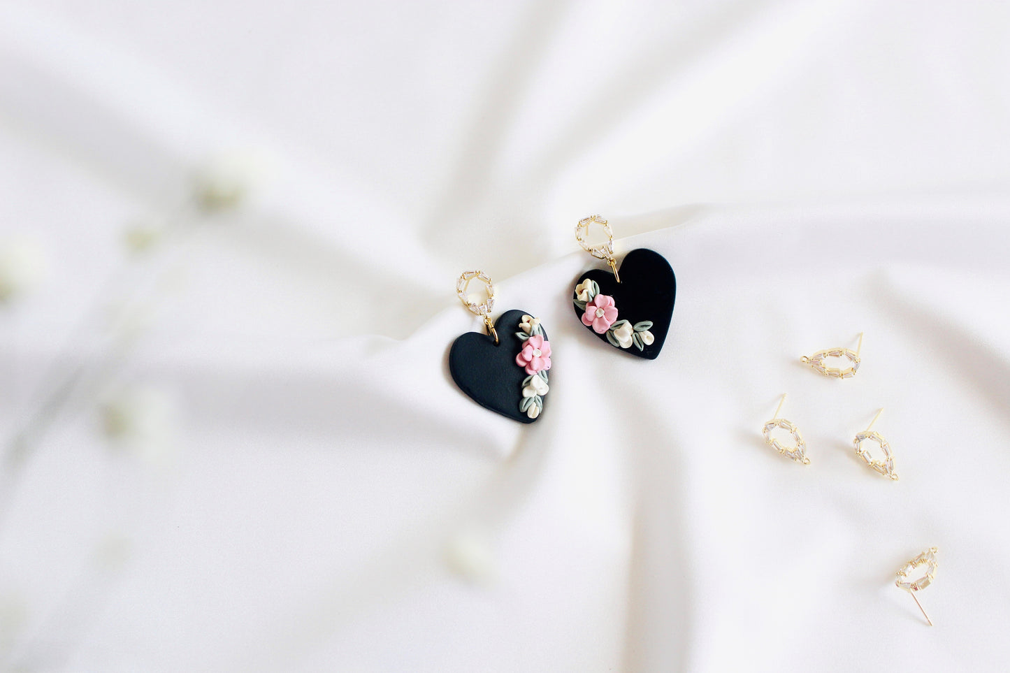 heart black flower clay earrings