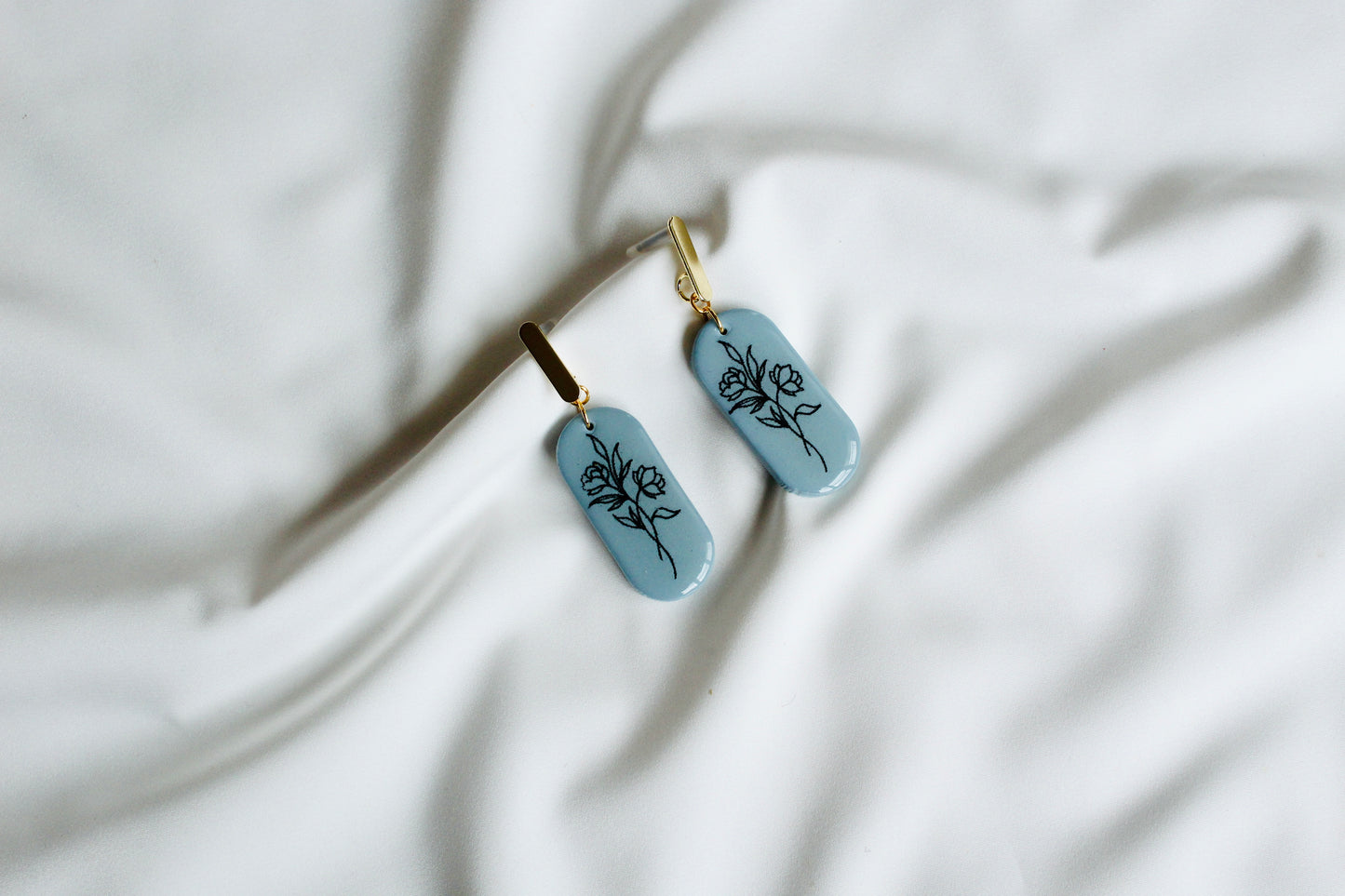 Soft blue floral texture statement earrings